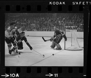 Boston Bruins player, Tommy Williams (no.11), shooting at Toronto Maple Leafs goal