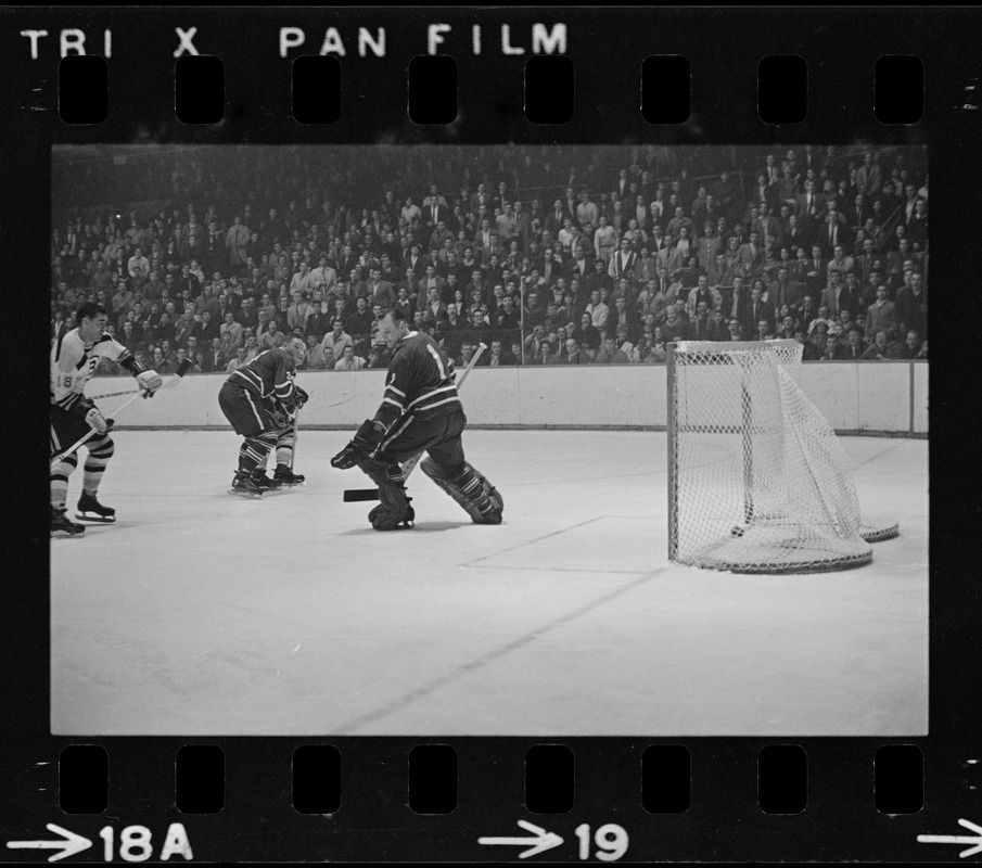 Toronto Maple Leaf goalie, Johnny Bower (no. 1), in front of goal in game against the Boston Bruins