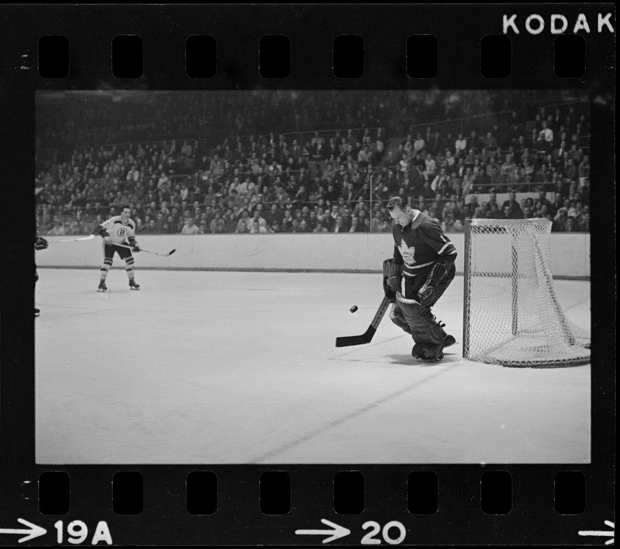 Toronto Maple Leaf goalie, Johnny Bower (no. 1), defending goal in game against the Boston Bruins