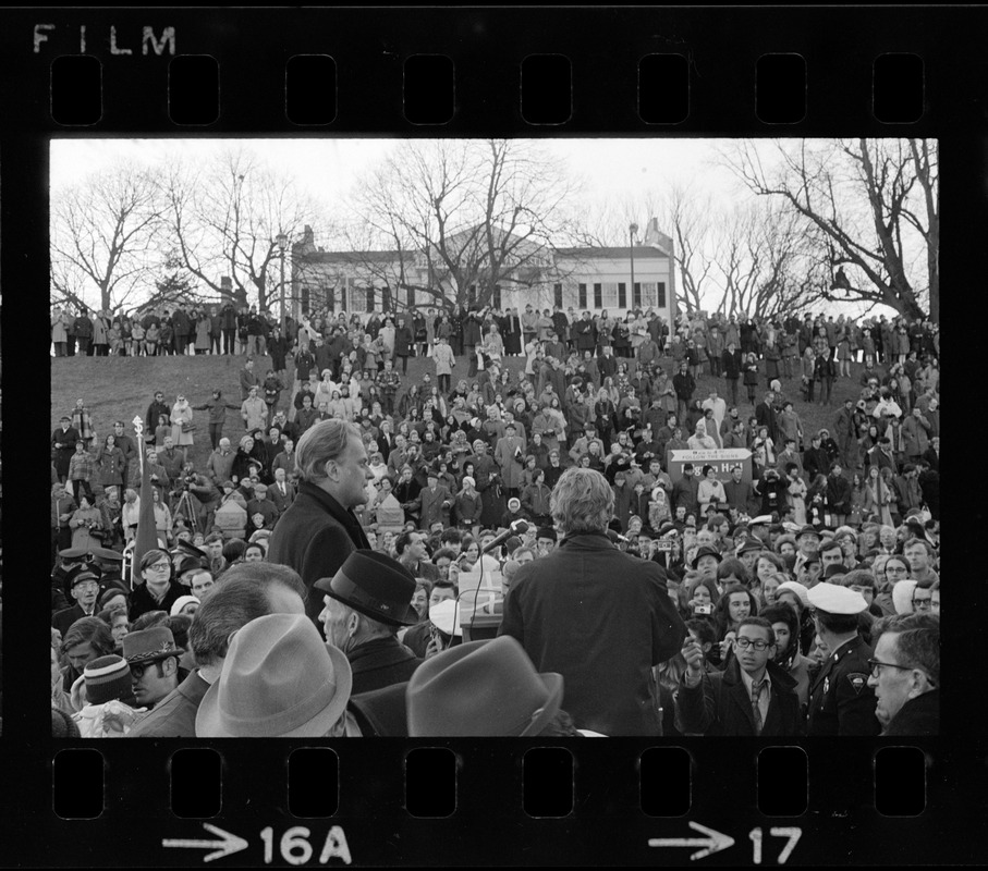 Crowd seen on hill in front of former Plymouth National Wax Museum to