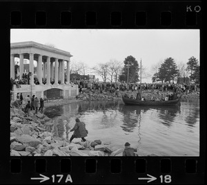 Crowd on waters edge by the Plymouth Rock monument to watch re-enactment of the landing of the Pilgrims