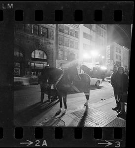 Police officer on horse in street during Boston blackout