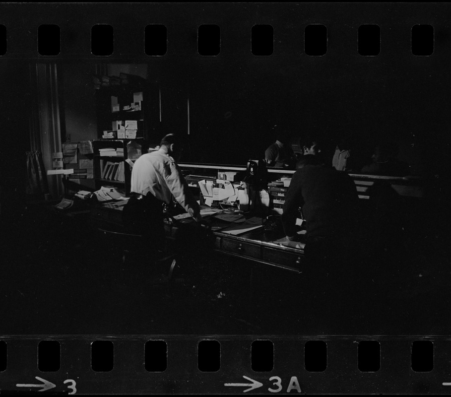 People working behind desk in office during Boston blackout