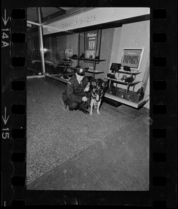 Police officer with dog outside of Florsheim Shoes, Boston blackout