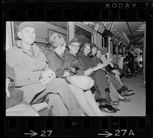 Row of people on train during Boston blackout