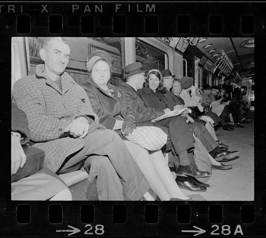 Row of people on train during Boston blackout