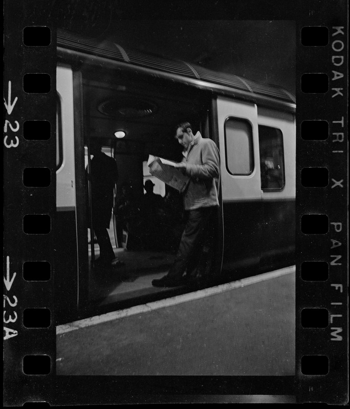 Man waiting in train car doorway during Boston blackout