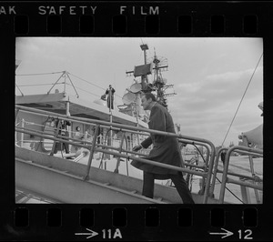 Rolf Pauls, ambassador from Germany, walking aboard ship for the transfer and commissioning of a German missile destroyer