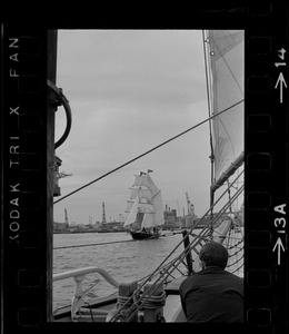 Framed through the rigging of the schooner, Spray, the sailing ship Black Pearl sails out of Boston Harbor, concluding the commemoration of the Hawaiian Mission Sesquicentennial