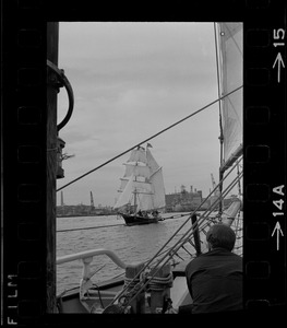 Framed through the rigging of the schooner, Spray, the sailing ship Black Pearl sails out of Boston Harbor, concluding the commemoration of the Hawaiian Mission Sesquicentennial