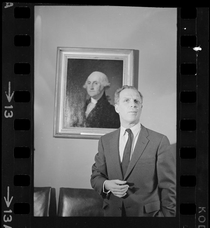Mayor of Boston Kevin White standing in front of a Gilbert Stuart portrait of George Washington