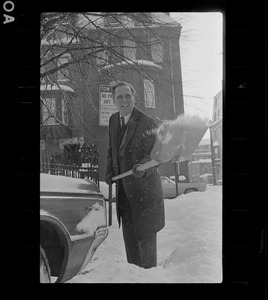 Boston's energetic new Mayor, Kevin White, works up a sweat while shoveling his car out of a deep snowbank outside of his Beacon Hill home