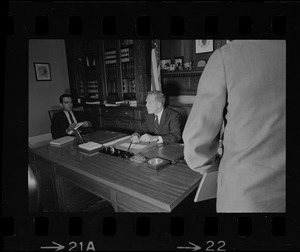 Secretary of State Kevin White sitting at his desk