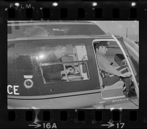 Boston Mayor Kevin White inside of police helicopter, about to survey the city from above
