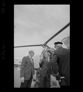 Boston Mayor Kevin White, Police Lieutenant John Dow and one other man discussing the helicopter for police work at City Hall Plaza