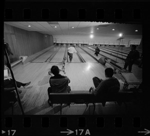 Mayor Kevin White bowling while Boston Police bowling team members watch in the foreground at Lucky Strike Alley