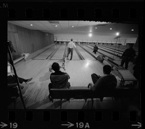 Mayor Kevin White bowling while Boston Police bowling team members watch in the foreground at Lucky Strike Alley
