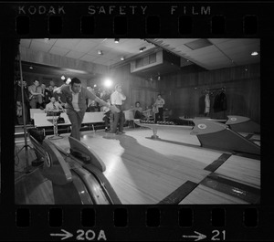 Member of Boston Police bowling team at Lucky Strike Alley with Mayor of Boston Kevin White seen behind him