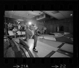 Member of Boston Police bowling team at Lucky Strike Alley with Mayor of Boston Kevin White seen behind him