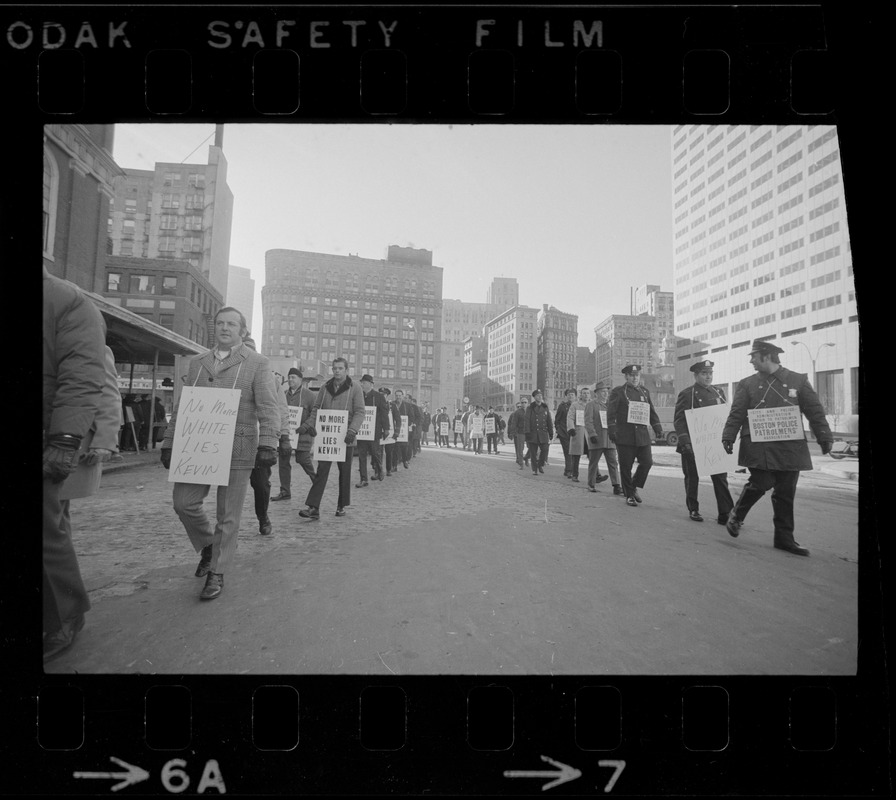 Ring of off-duty policemen circle Faneuil Hall during the inauguration of Mayor White