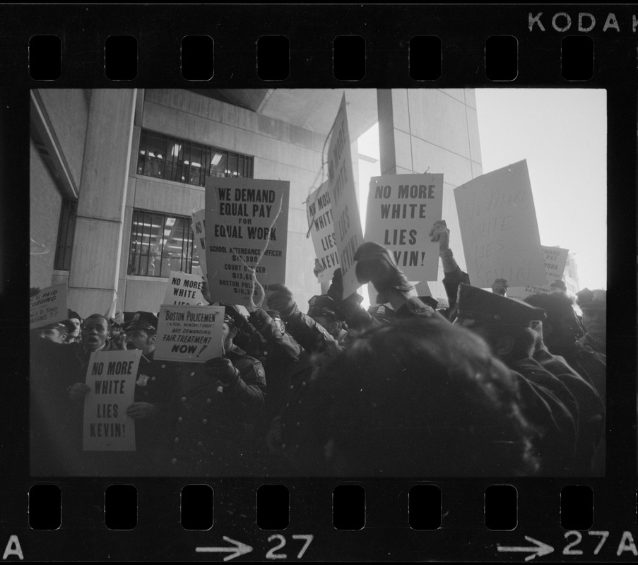 Members of the Boston Police Ass'n are outspoken in their demands that Mayor White keep his promise of equal pay for equal work in a boisterous assembly at City Hall after White's inauguration