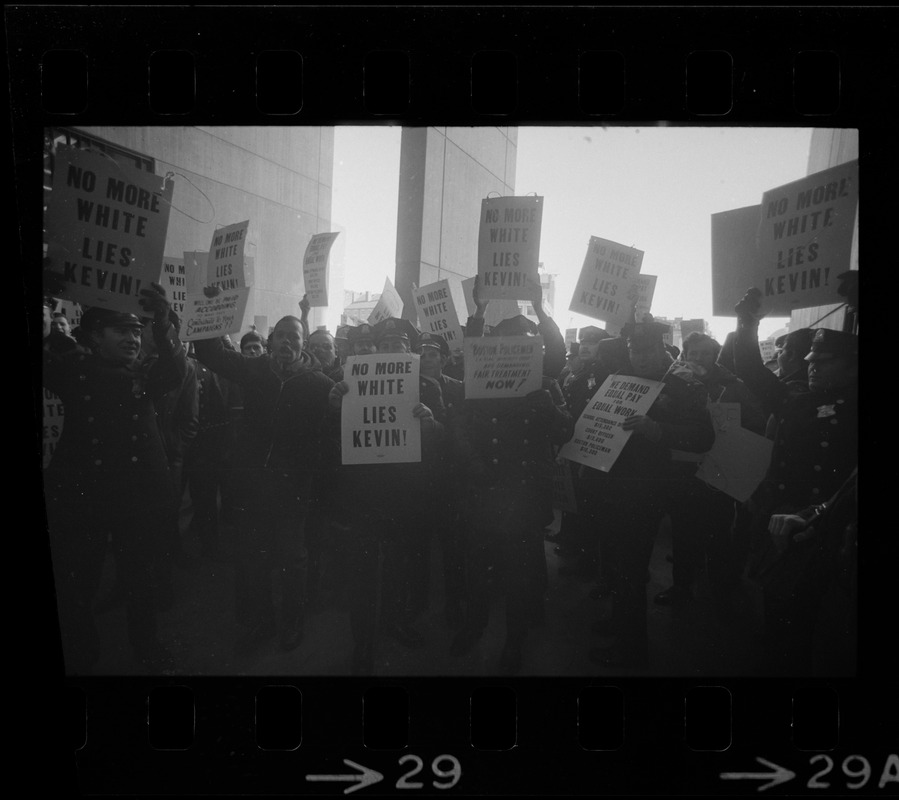 Members of the Boston Police Ass'n are outspoken in their demands that Mayor White keep his promise of equal pay for equal work in a boisterous assembly at City Hall after White's inauguration