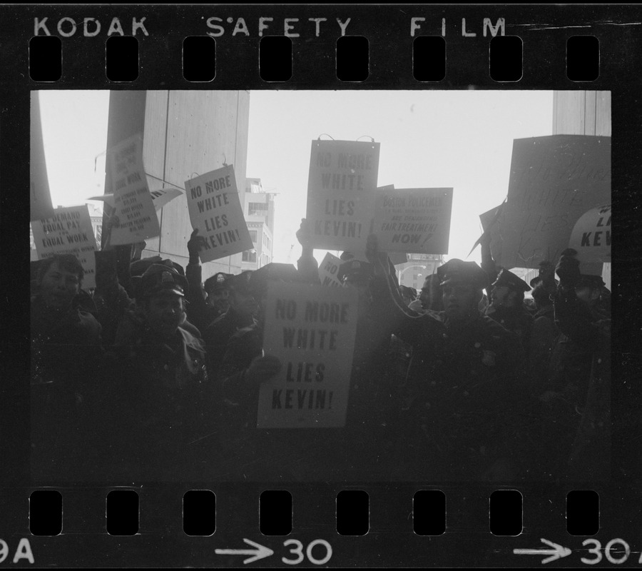 Members of the Boston Police Ass'n are outspoken in their demands that Mayor White keep his promise of equal pay for equal work in a boisterous assembly at City Hall after White's inauguration