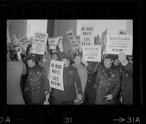 Members of the Boston Police Ass'n are outspoken in their demands that Mayor White keep his promise of equal pay for equal work in a boisterous assembly at City Hall after White's inauguration