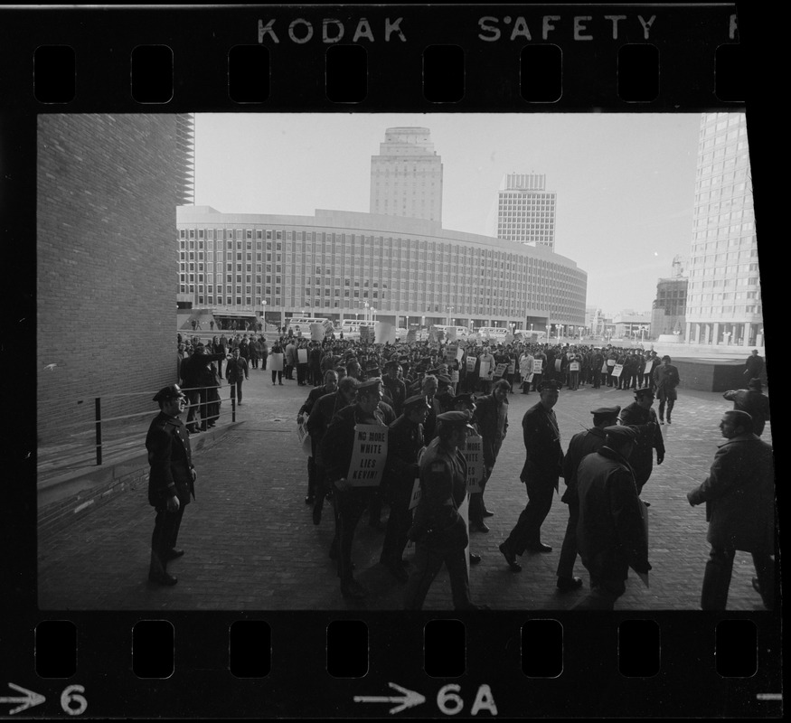 Members of the Boston Police Association picketing for equal pay for equal work outside of City Hall after White's inauguration