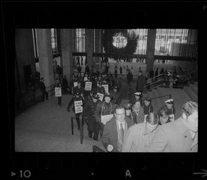 Members of the Boston Police Association entering City Hall to demand that Mayor White keep his promise of equal pay for equal work after White' s inauguration