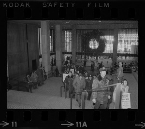 Members of the Boston Police Association entering City Hall to demand that Mayor White keep his promise of equal pay for equal work after White' s inauguration