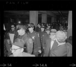 Members of the Boston Police Association entering City Hall to demand that Mayor White keep his promise of equal pay for equal work after White' s inauguration