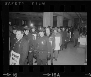 Members of the Boston Police Association in City Hall to demand that Mayor White keep his promise of equal pay for equal work after White' s inauguration