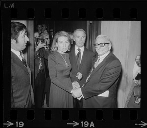Kathryn White, shaking hands with City Council president, Gabriel F. Piemonte, and standing next to her husband Kevin White at Mayor White's inauguration