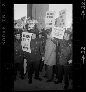 Members of the Boston Police Ass'n are outspoken in their demands that Mayor White keep his promise of equal pay for equal work in a boisterous assembly at City Hall after White's inauguration