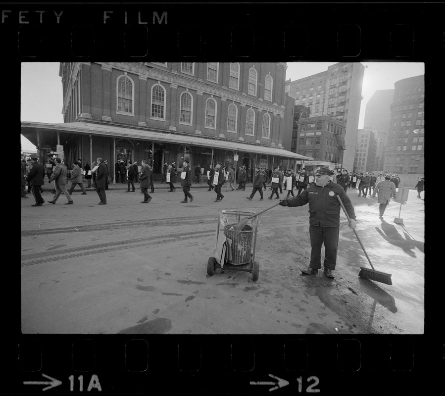 Ring of off-duty policemen circle Faneuil Hall during the inauguration of Mayor White