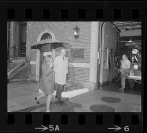 Boston Mayor Kevin White and Kathryn White walking through rain to vote in the primary