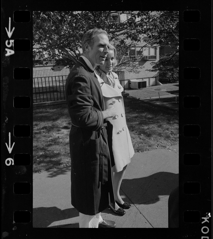 Boston Mayor Kevin White, who underwent surgery last Wednesday night for a bleeding ulcer, is all smiles as he takes a brief walk with his wife, Kathryn, in the garden of Mass. General Hospital