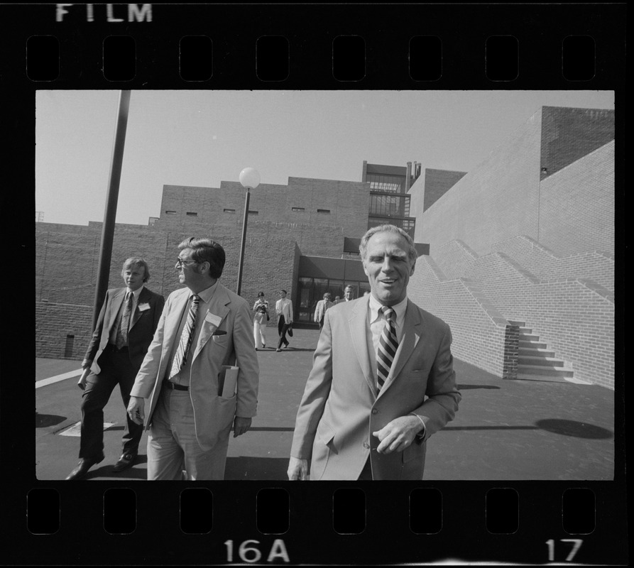 Boston Mayor Kevin White seen outside entrance while taking a tour of new schools