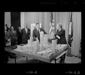 Mayor White, right, with architect Pietro Belluschi, left, and developer Daniel Rose, middle, looking at model of area where 60-story skyscraper is to be constructed