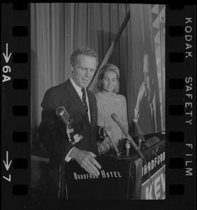 Boston Mayor Kevin White speaking at Bradford Hotel on election night of primary race for governor of Massachusetts while his wife Kathryn looks on