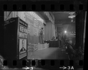 Stage at Bradford Hotel being decorated with "Kevin White for Governor" posters
