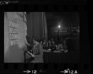Man filling in election returns on tracking board at Kevin White's election night party at Bradford Hotel during primary race for governor of Massachusetts