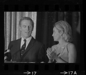 Boston Mayor Kevin White speaking at Bradford Hotel on election night of primary race for governor of Massachusetts while his wife Kathryn looks on