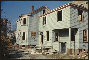 Exterior of dilapidated house with graffiti on walls, Somerville, Massachusetts