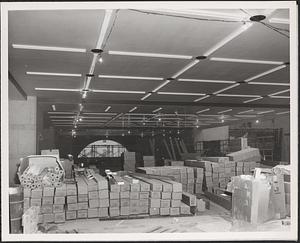 Construction of Boylston Building, Boston Public Library, boxes stacked on second floor