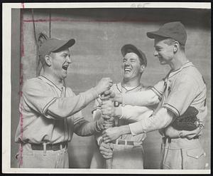 Off the a Roaring Start- Tufts College, baseball Coach John "Jit" Ricker (left) Outfielder Rudy Fobert (center) and First Baseman George Minot seem to be uproariously happy as they choose up sides for an intra-squad practice at Cousens cage, where the Jumbos are preparing for the coming season.