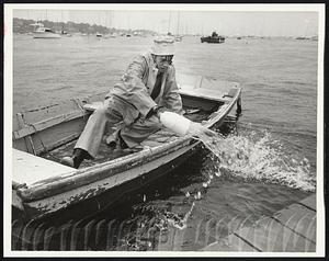 Clark Miller of Marblehead bailing out dingy