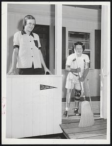 Top Camper Despite Handicap-Eight-year-old Donna Richardson of Danvers handles her crutches and broom at the same time at Sea Haven Camp on Plum Island. Donna was chosen camper of the day at the vacation retreat for infantile paralysis victims. With her is counselor Sylvia Carliss, 18, of Gloucester, a Simmons College Student.