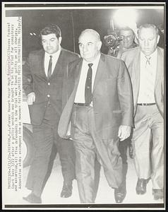 Trenton, N.J.: Former Newark Mayor Hugh Addonizio (C) leaves Federal Court late 7/22 after a guilty verdict was brought in on his trial for conspiracy and extortion. All five defendants in the trial were found guilty on all charges. Addonizio's aides accompany him as newsmen follow.